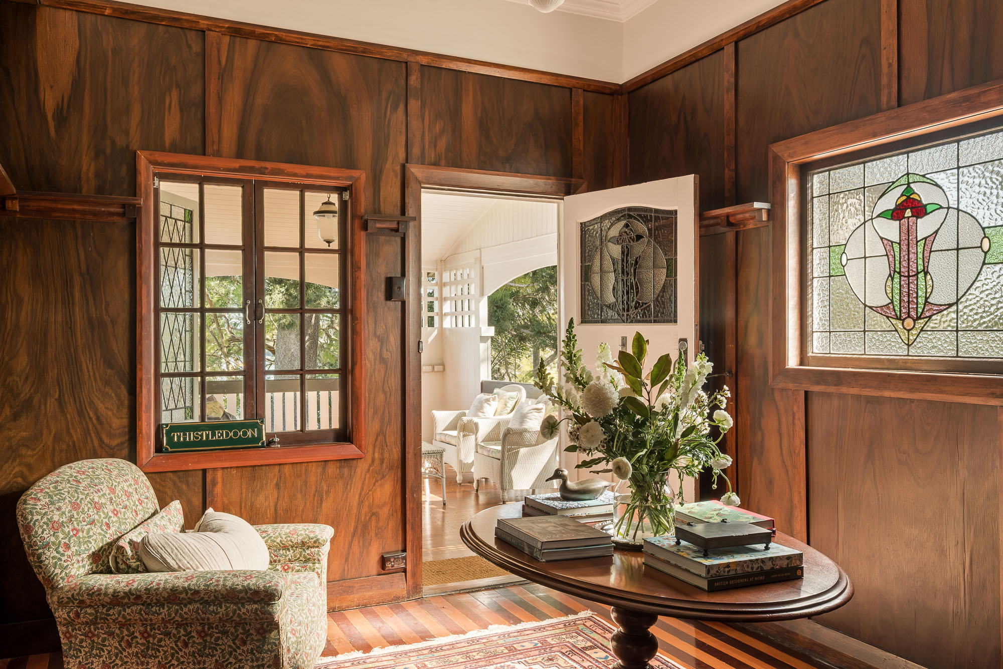 Timber-lined room with original leadlight windows