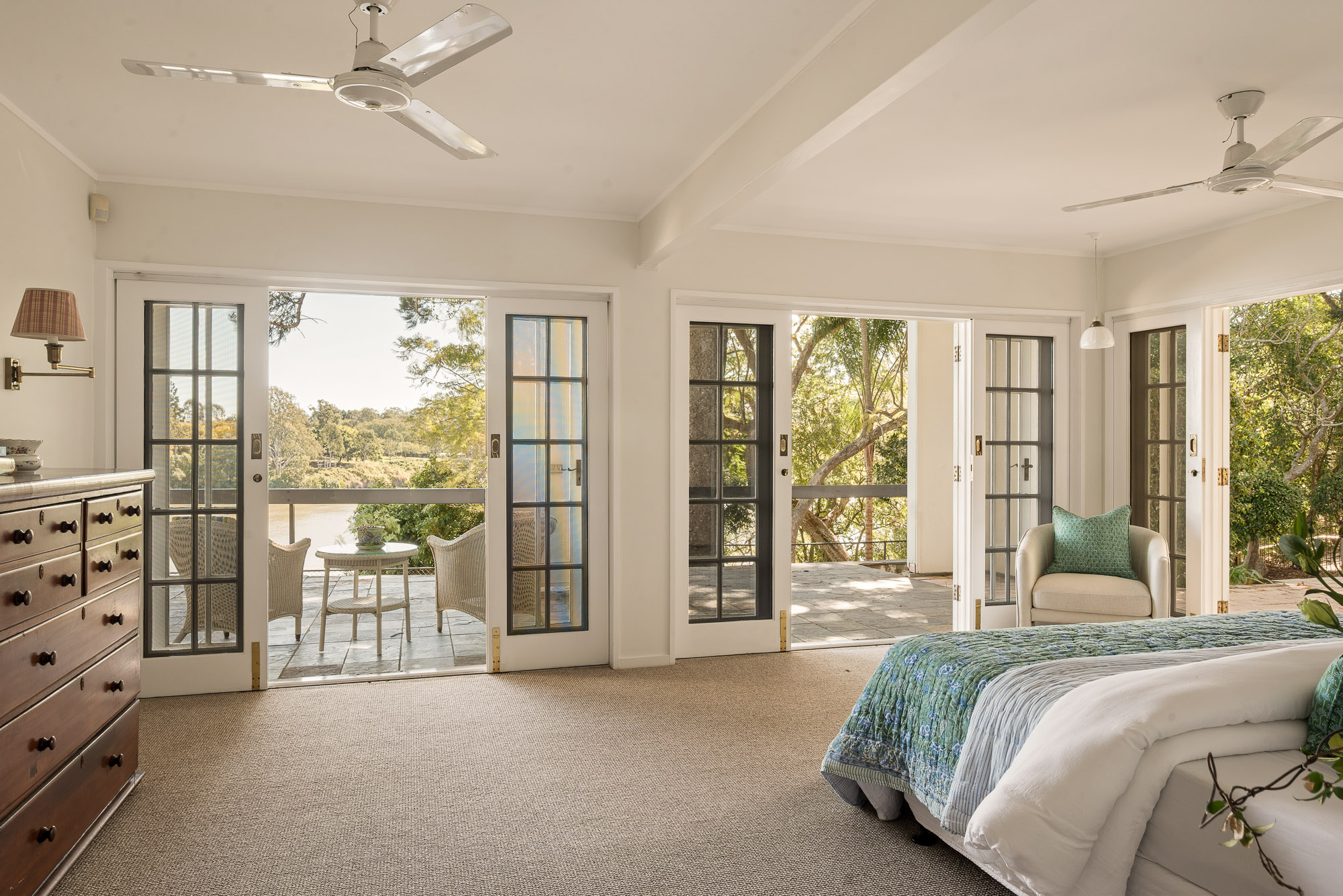 River-facing bedroom opening to private terraces