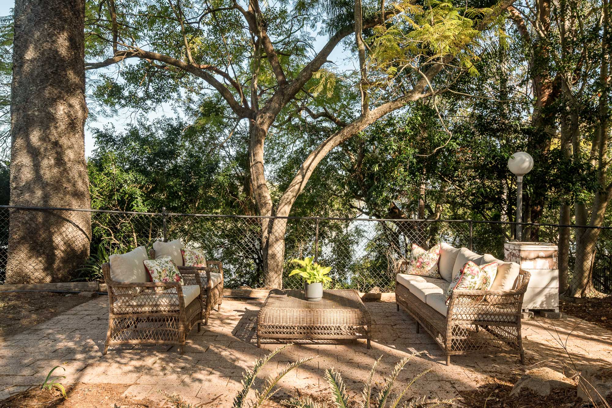 Secluded garden terrace beneath established trees